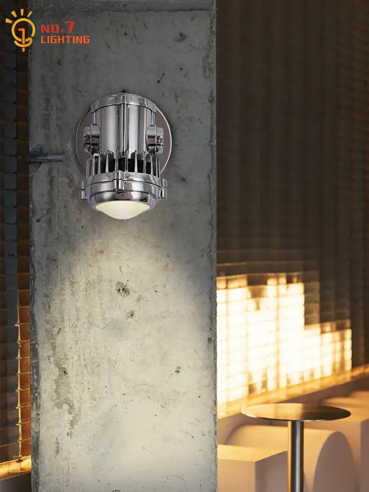Industrial chrome adjustable wall lamp with cylindrical ribbed housing in chrome finish as an industrial wall lamp