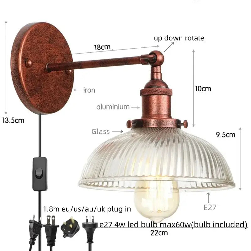 Copper-finished industrial wall sconce with clear ribbed glass shade and adjustable arm from Decorbites clear glass collection