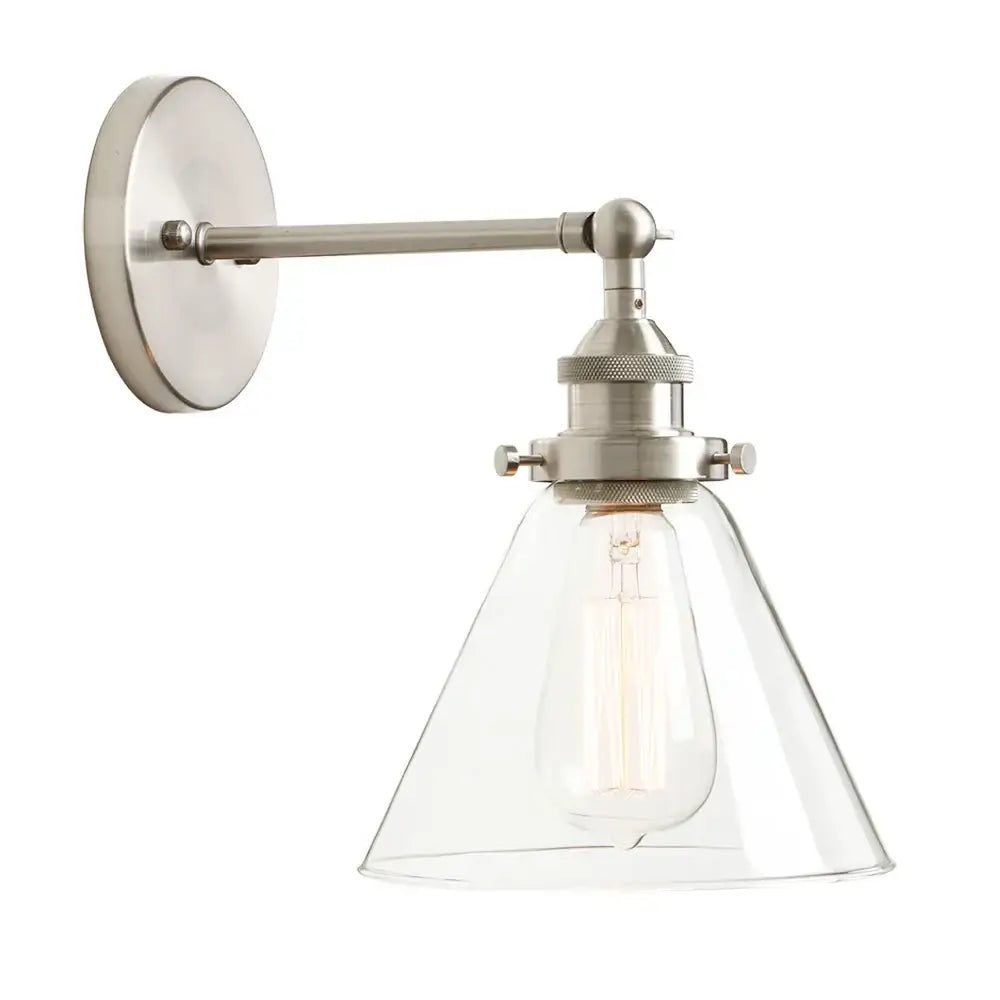 Industrial chrome wall sconce with brushed nickel finish, clear glass shade, and exposed edison bulb light fixture for bedroom