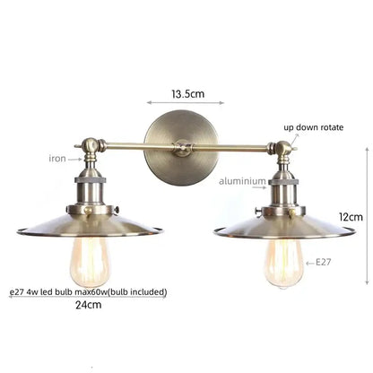 Vintage-style brass-finished decorbites dual head wall light with two adjustable arms and dual head pink conical shades