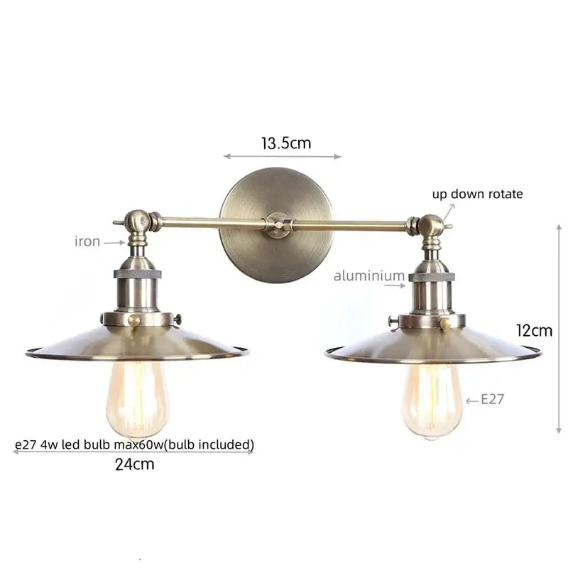 Vintage-style brass-finished decorbites dual head wall light with two adjustable arms and dual head pink conical shades