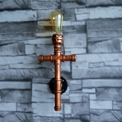 Industrial copper iron pipe wall sconce with vintage filament bulbs for living room decorbites industrial iron lighting