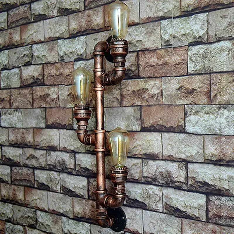 Industrial copper iron pipe wall sconce with three vintage edison bulbs for decorbites industrial iron lighting decor