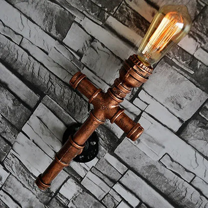 Copper-colored industrial iron pipe wall sconce with vintage filament bulb for decorbites industrial iron living room decor