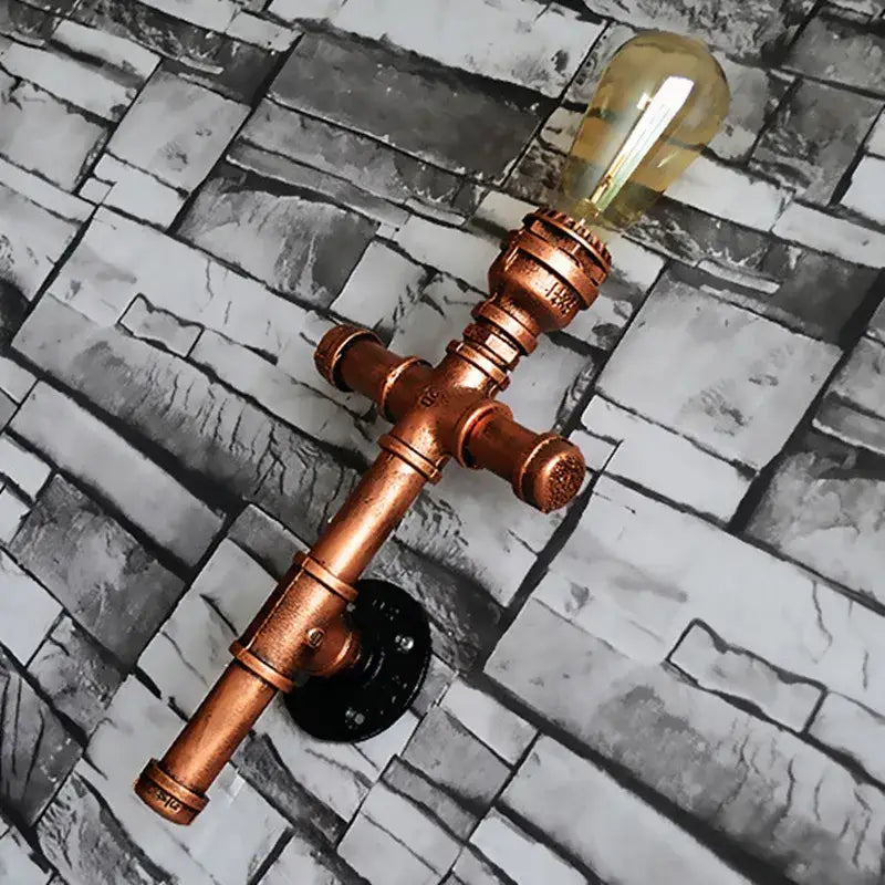 Industrial copper iron pipe wall sconce with vintage amber glass bulb for living room decorbites industrial iron lighting