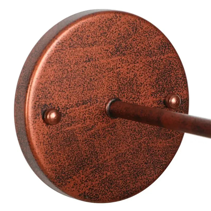 Copper-finished circular wall light base with rustic texture and rivets for decorbites loft clear glass bedroom sconce
