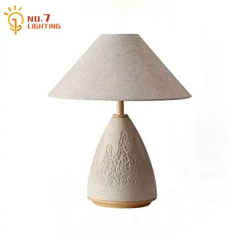 Beige industrial ceramic table lamp with textured mountain relief and matching fabric shade for decorbites concrete led table
