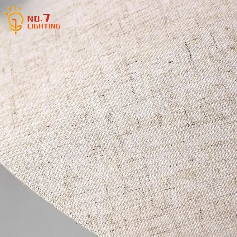 Beige linen fabric with subtle textured weave complements industrial cream ceramic table lamp for decorbites concrete led table use