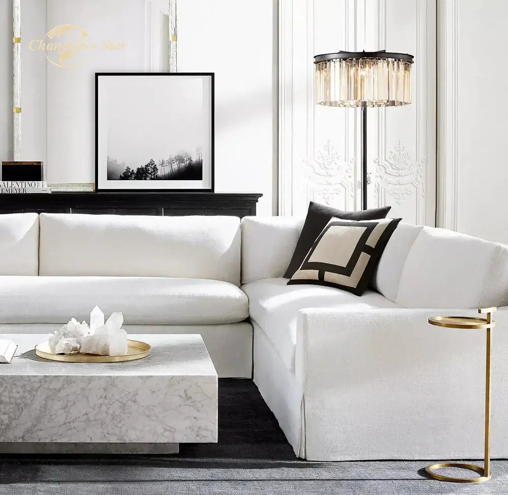 White sectional sofa with soft upholstery next to decorbites industrial crystal led black chrome floor lamp in living room