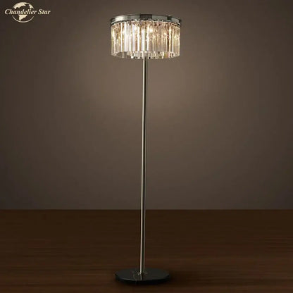 A sleek industrial crystal led floor lamp with black chrome pole and circular chandelier shade for living room decorbites