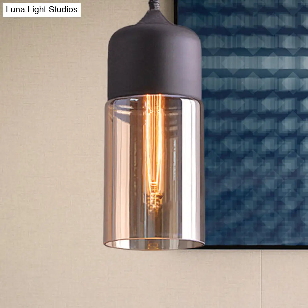 Industrial Cylinder Pendant Light with Brown Glass Shade - 1-Light Hanging Ceiling Fixture in Black, 5"/7"/8" Wide