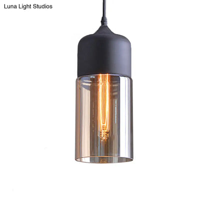 Industrial Cylinder Pendant Light with Brown Glass Shade - 1-Light Hanging Ceiling Fixture in Black, 5"/7"/8" Wide