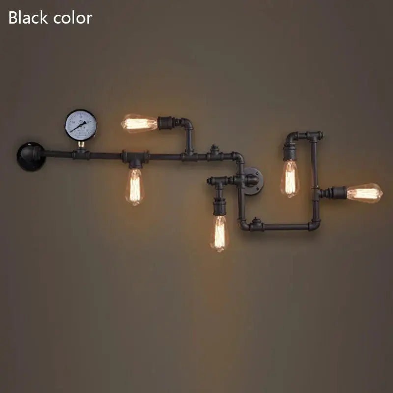Industrial dark brass pipe wall lights with four exposed filament bulbs and pressure gauge for living room use