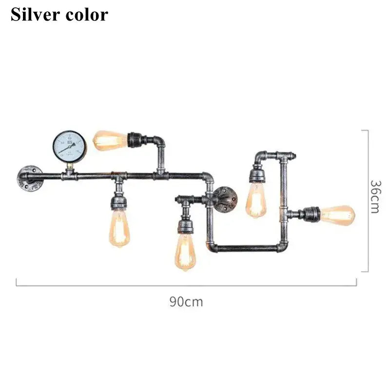 Industrial dark brass pipe wall lights featuring four exposed filament bulbs and a pressure gauge accent for living rooms