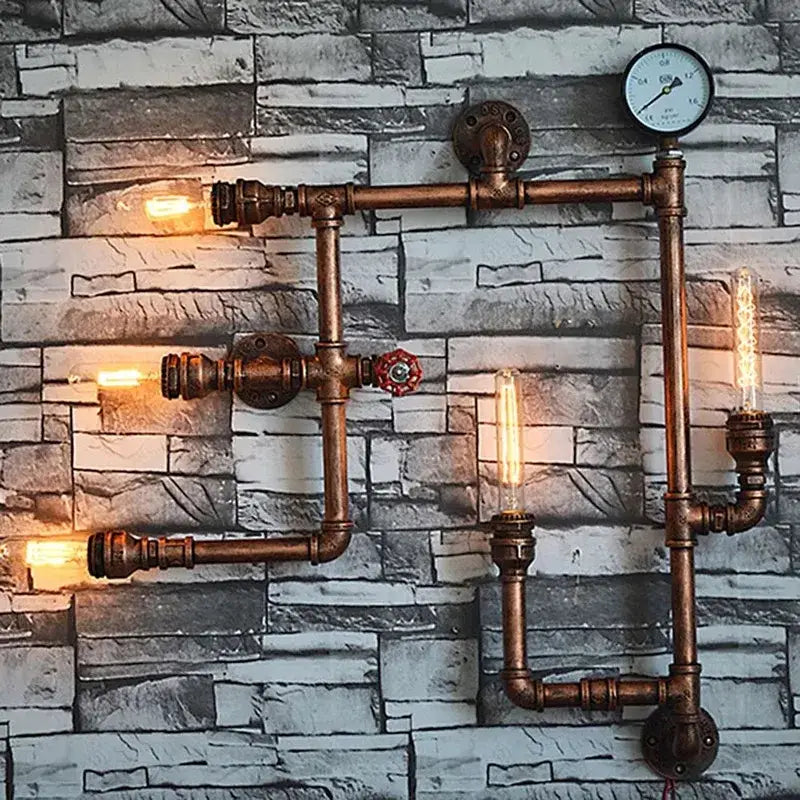 Industrial dark brass pipe wall lights featuring copper pipes, exposed Edison bulbs, and a pressure gauge for living rooms