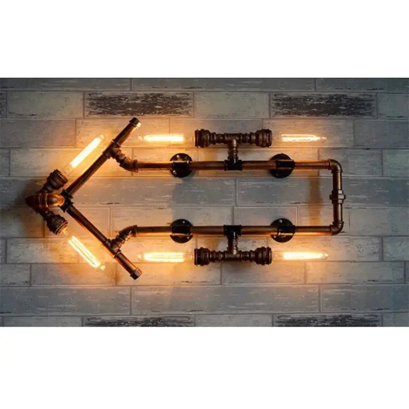 Industrial dark brass pipe wall lights featuring four glowing edison bulbs in a geometric pipe wall lights design