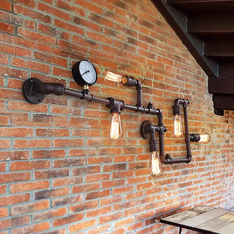 Industrial dark brass pipe wall lights featuring rustic metal pipes and vintage edison bulbs for living room use