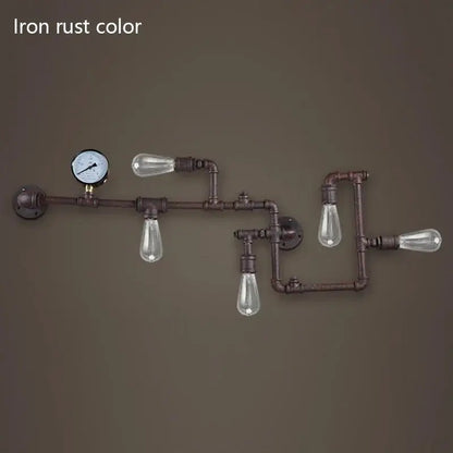 Industrial dark brass pipe wall lights with rust-colored iron pipes and clear glass bulbs for living room use