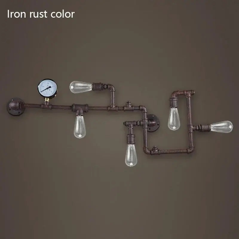 Industrial dark brass pipe wall lights with rust-colored iron pipes and clear glass bulbs for living room use