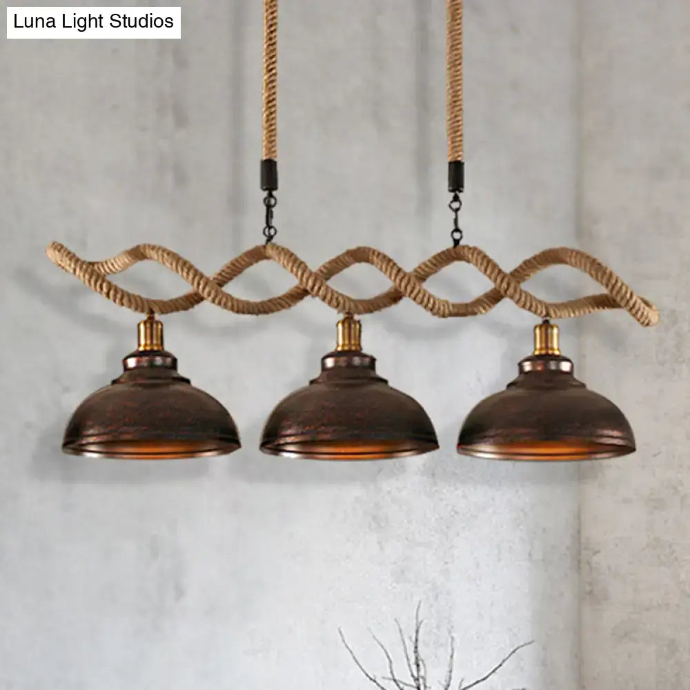 DecorBites™ three-bulb industrial pendant light with dark bronze metal shades and rope suspension for kitchen island