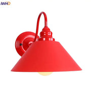 Vibrant red metal wall lamp with classic conical shade and curved arm featuring edison red led for vintage bedroom use