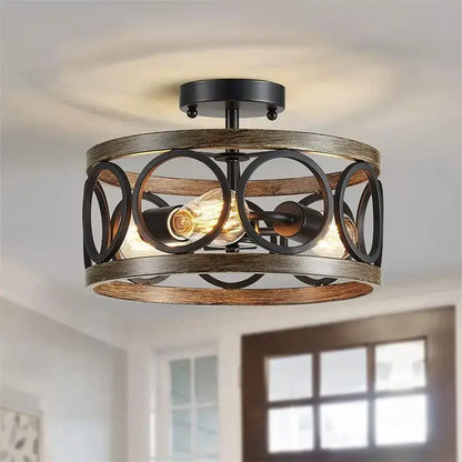 Rustic black and wood finished industrial farmhouse chandelier with circular metal rings for dining room decorbites industrial farmhouse