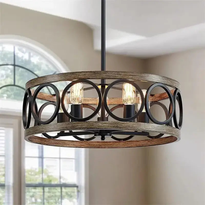 Rustic black and wood-toned industrial farmhouse circular chandelier with exposed edison bulbs for dining room decorbites industrial farmhouse