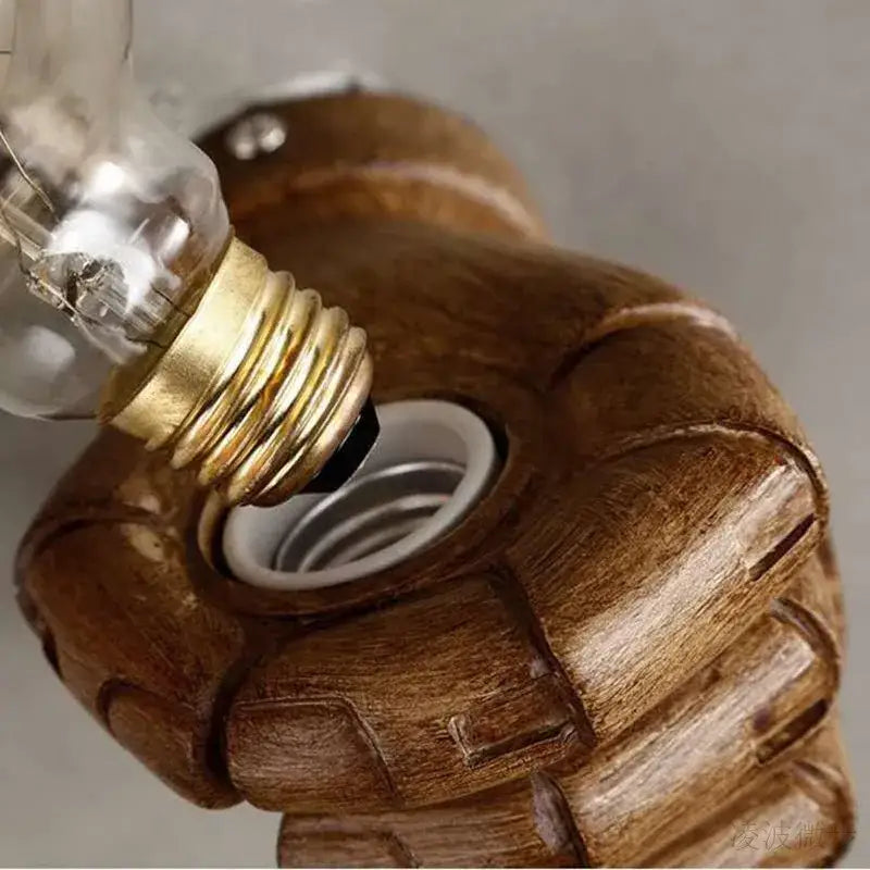 Rustic wooden wall lamp base shaped like a clenched fist with detailed grain decorbites industrial fist resin design