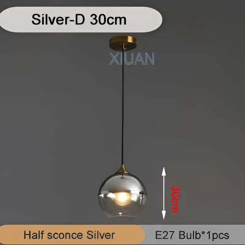 Silver spherical industrial glass pendant light with clear glass globe and brass accents for kitchen and dining decorbites industrial glass pendant