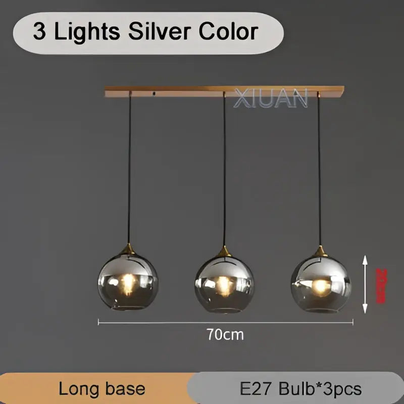 Silver-colored industrial glass pendant light with three spherical globes hanging from a wooden bar for kitchen decorbites industrial glass