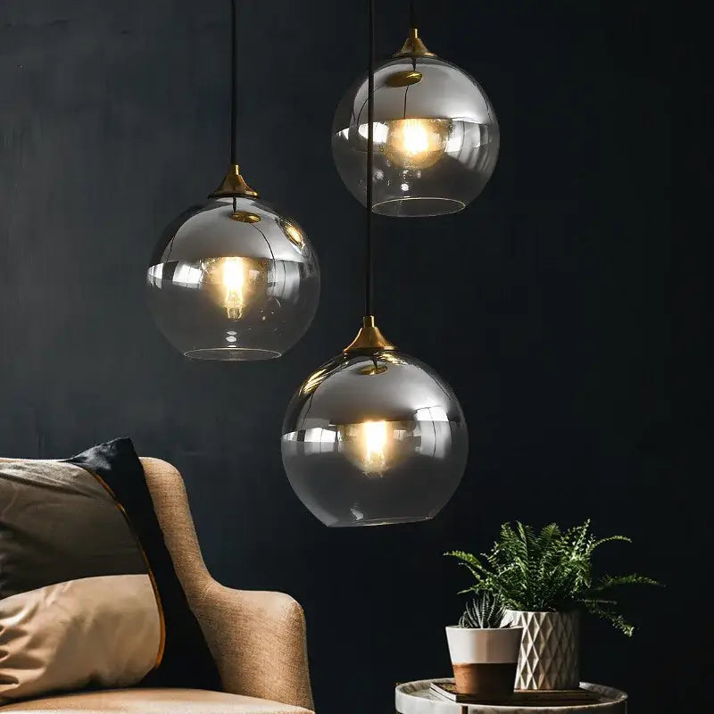 Industrial glass pendant light with three warm glass spheres and brass fixtures for kitchen or dining room decorbites industrial glass