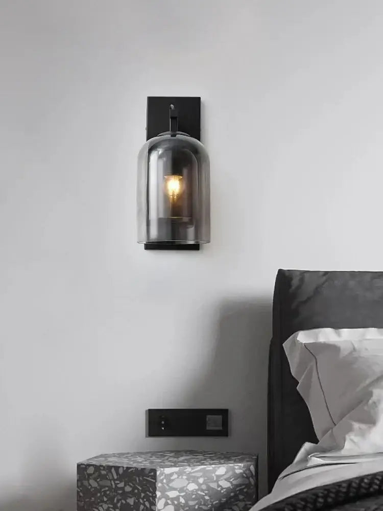 Black metal industrial glass wall sconce with smoked clear dome illuminating bulb for bedroom wall lamps decorbites industrial glass