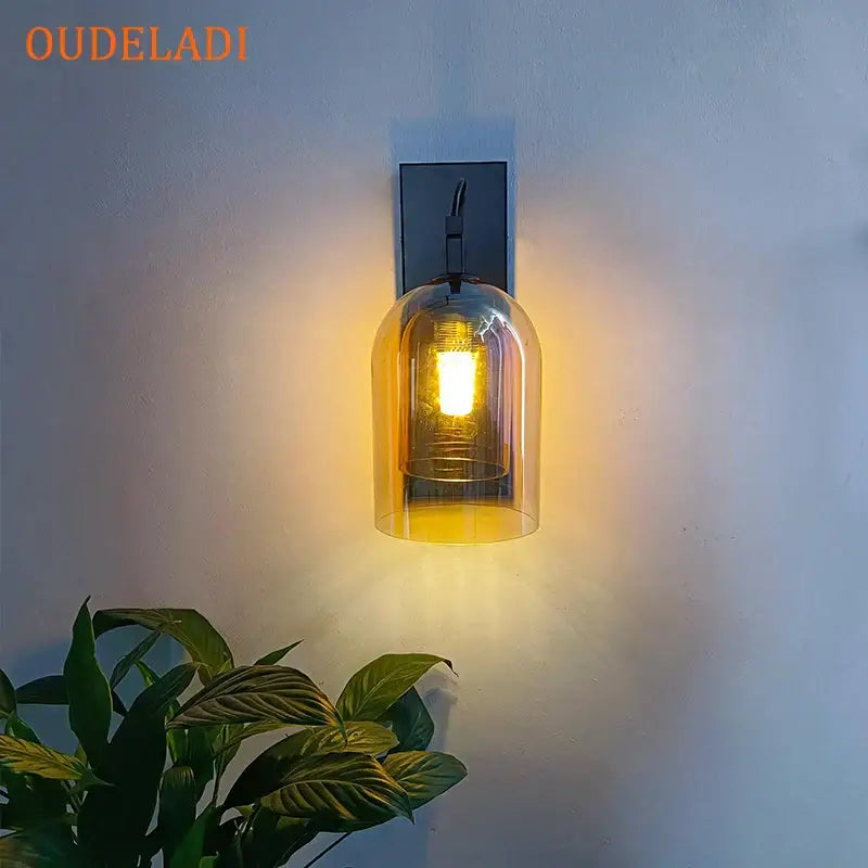 Oudeladi wall lamp with clear glass dome and dark metal backplate perfect for decorbites industrial glass wall use