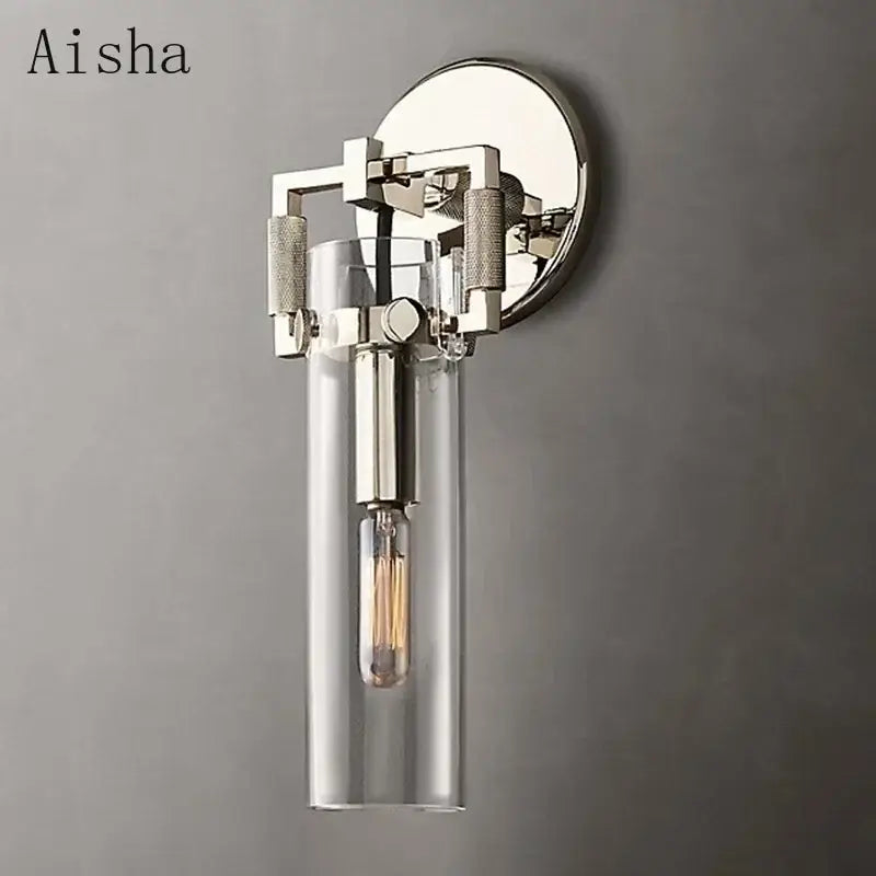 A sleek industrial glass wall lamp with polished chrome finish and clear shade for bedroom decorbites industrial glass