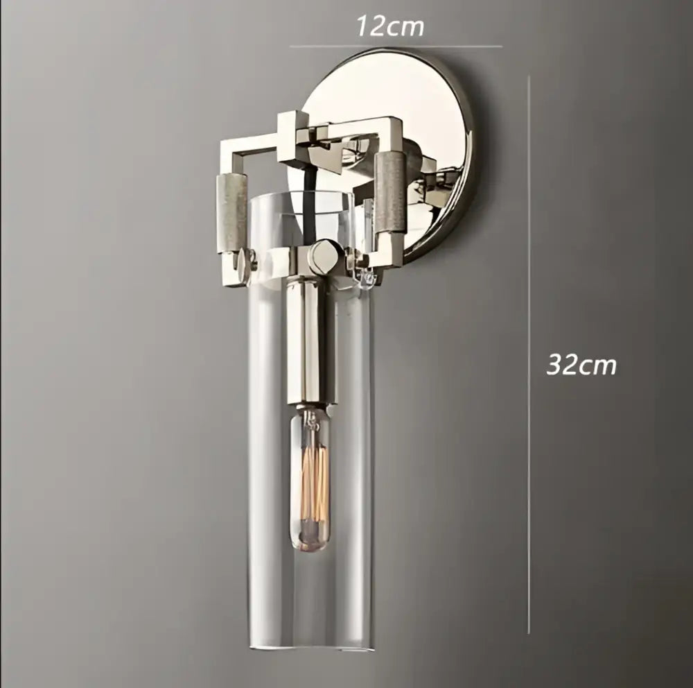 A sleek industrial glass wall lamp with polished chrome finish and clear glass shade for bedroom decorbites industrial glass