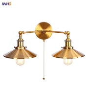 Brass-finished industrial led wall double arm sconce with conical shades and decorbites gold vintage exposed bulbs