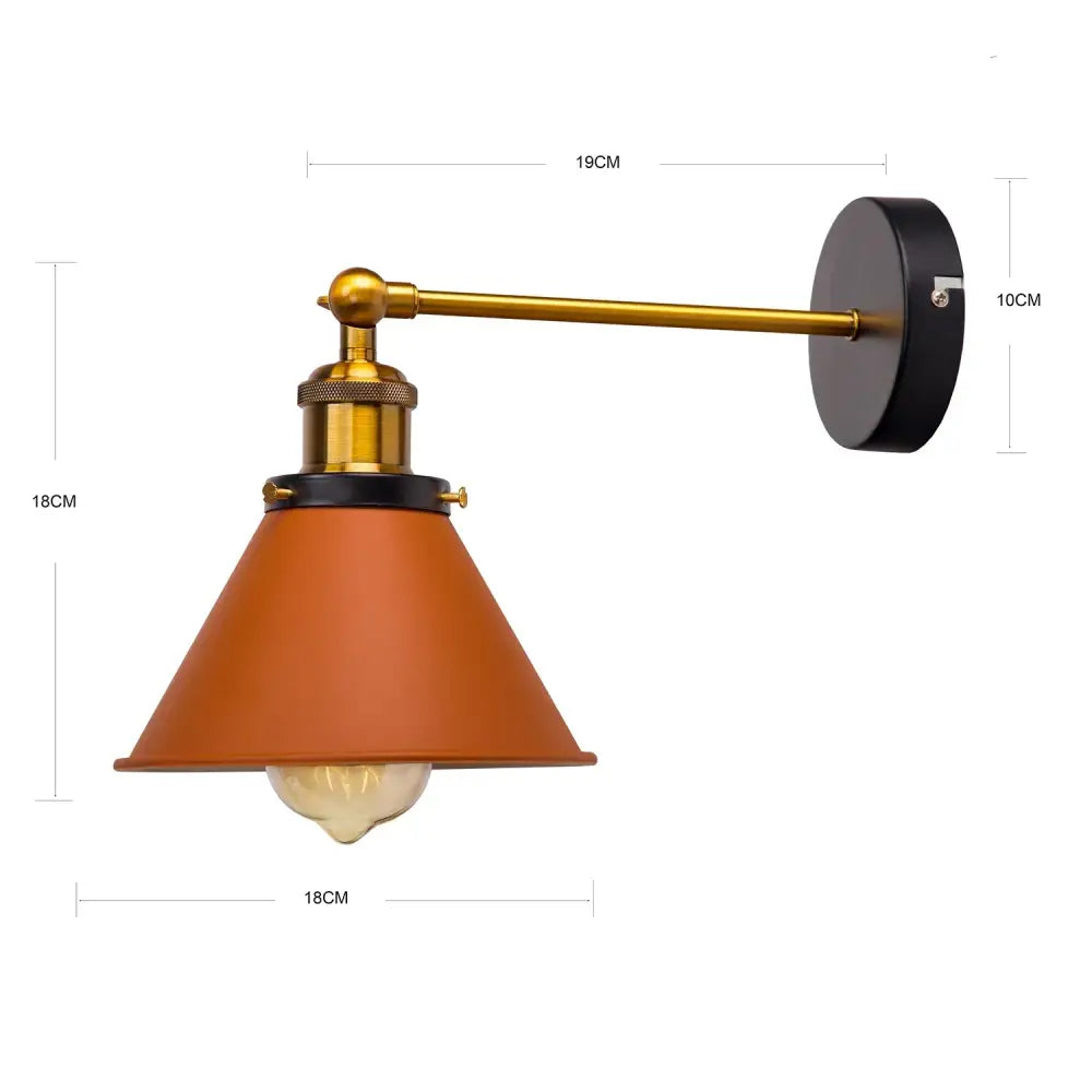 Industrial gold wall lamp with brass adjustable arm and orange conical shade from decorbites industrial gold collection