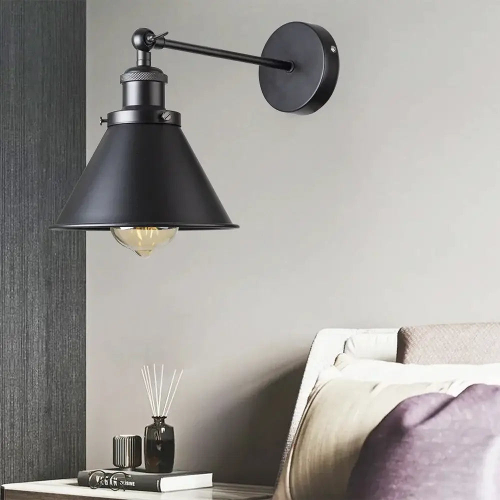 Black industrial-style wall lamp with matte finish and conical shade for decorbites industrial gold wall decor