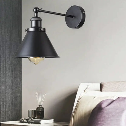 Black industrial-style wall lamp with matte finish and conical shade for decorbites industrial gold wall decor