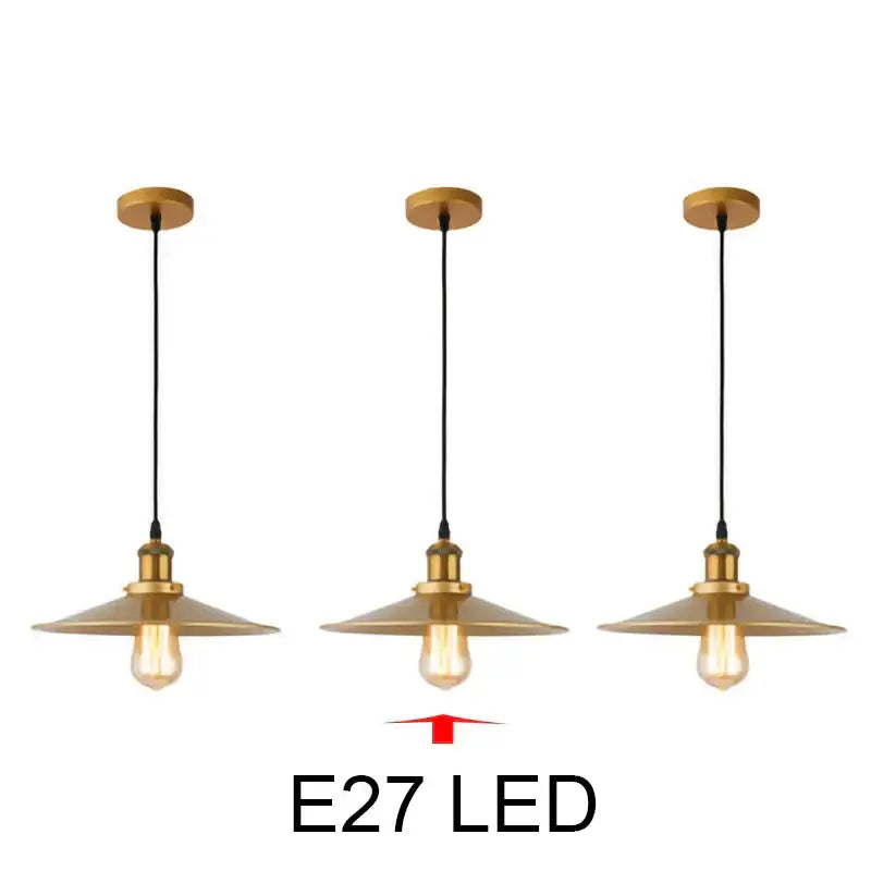 Set of three brass-finished industrial-style pendant lights with conical shades and exposed edison bulbs gold wrought iron decorbites pendant light