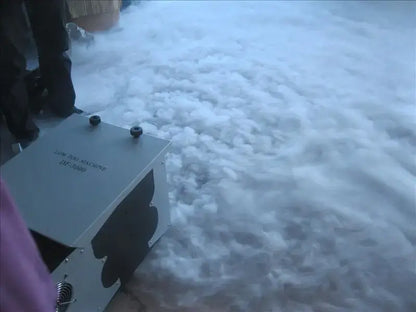Industrial gray metal 3000w low lying ground fog machine labeled cold atmosphere with black circular caps on top