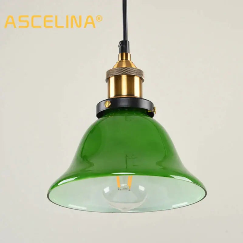 Industrial green glass pendant light with brass and black metal accents for dining room use pendant light