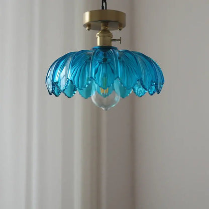 A vibrant blue glass industrial pendant light with petal design and brass hardware for dining room decorbites glass industrial