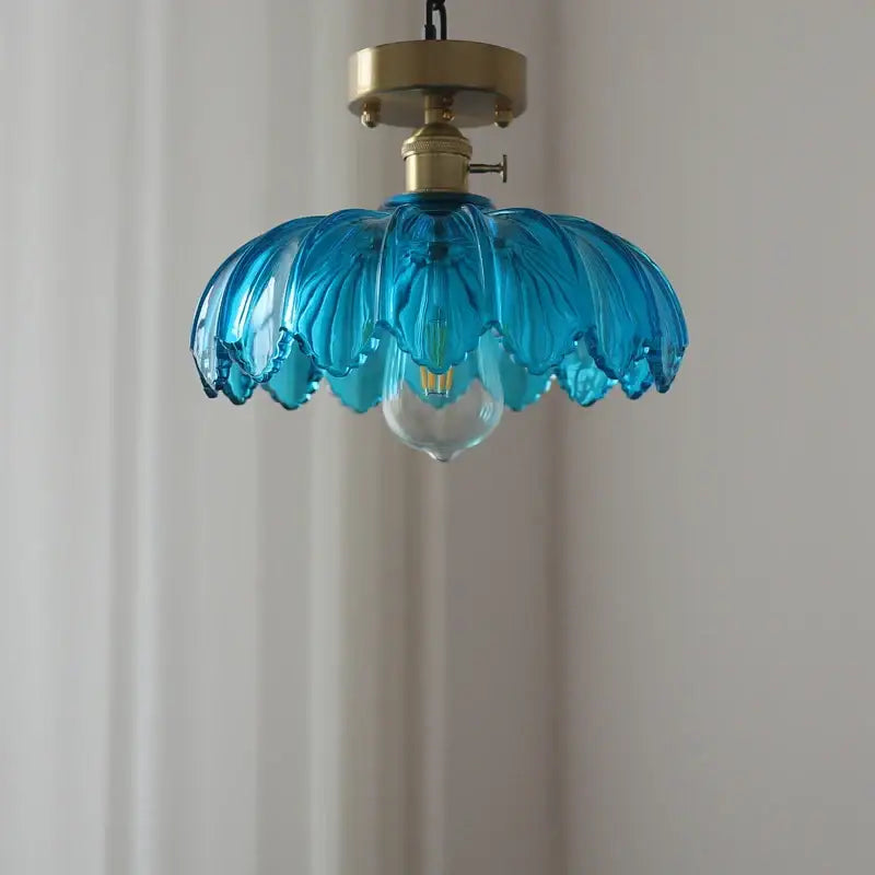 A vibrant blue glass industrial pendant light with petal design and brass hardware for dining room decorbites glass industrial