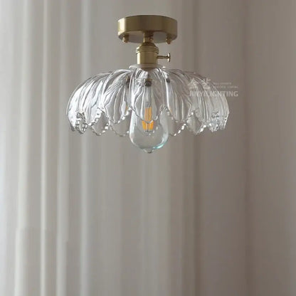 Clear leaf-shaped glass industrial pendant light with brass mount and exposed filament bulb for dining room decorbites glass industrial