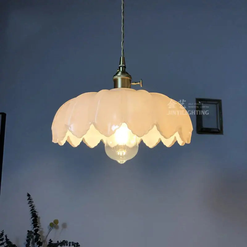 Cream-colored petal glass industrial pendant light with brass fixture and exposed bulb for dining room decorbites glass industrial