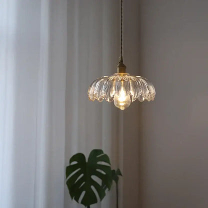 Industrial green petal glass pendant light with brass hardware featuring a delicate clear glass design for dining room decorbites glass industrial style