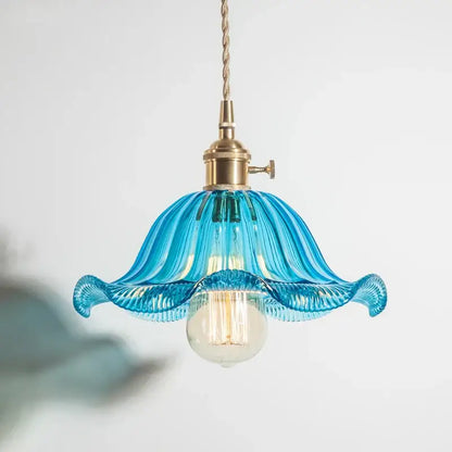A delicate blue glass industrial pendant light with fluted petal design and brass hardware for dining room decorbites glass industrial