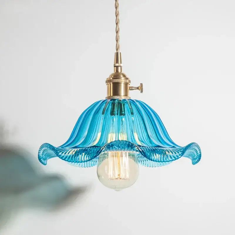 A delicate blue glass industrial pendant light with fluted petal design and brass hardware for dining room decorbites glass industrial