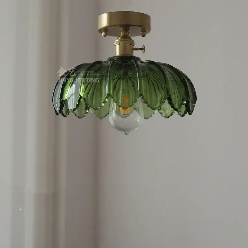 Vintage-style pendant light with brass fixture and olive-green petal glass shade for decorbites glass industrial decor
